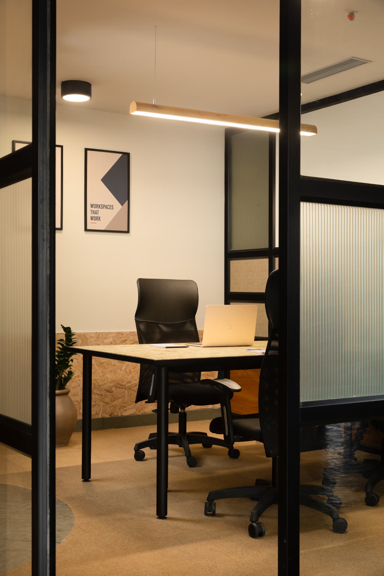 Private manager's cabin at Steadwork ORR | Panathur seen through black framed fluted glass partitions